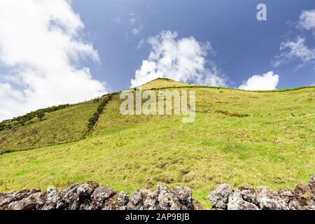 Hills and pastures on the eastern edge of Pico island in the Azores, Portugal. Stock Photo