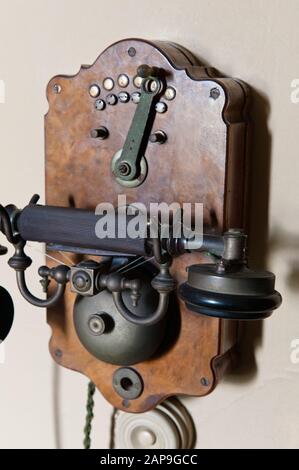 Telephone on the wall in Lady Stamford's Parlour at Dunham Massey, Cheshire. NT inventory number 931691. Stock Photo
