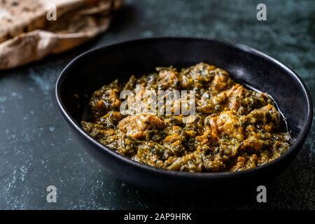 Indian Dish Spinach Lamb Palak with Chappati Flat Bread. Traditional Dish. Stock Photo