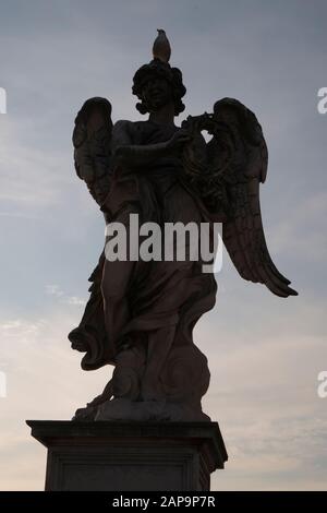 Angel with the crown of Thorns by Gian Lorenzo Bernini on Sant Angelo bridge Rome Italy Stock Photo