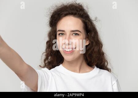 Young attractive woman blogger taking selfie shot. Stock Photo