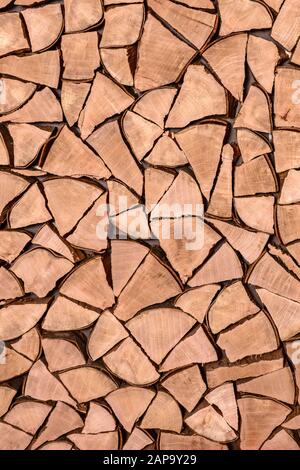 Split firewood as wall cladding, Switzerland Stock Photo