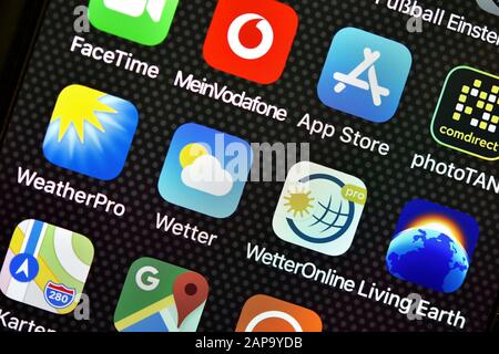 Various weather apps on display of an Apple iPhone, Germany Stock Photo