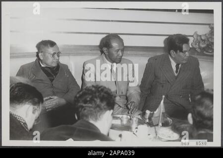 Arrival at Schiphol of the New Guinea delegation from the United States of Indonesia. After arriving at Schiphol, some of the delegation were prepared to speak to the journalists. Vlnr. Kasimo, chairman of the Catholic Indian Party; Soekiman, chairman Masjoemi and Yamin, independent member of parliament Date: 30 October 1950 Location: Noord-Holland, Schiphol Keywords: arrivals, delegations, press conferences, politicians Personal name: Kasimo, Soekiman Stock Photo