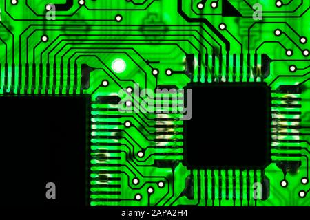 Green transparent circuit board with microchips Stock Photo
