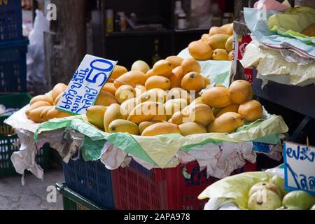 Mango fruits for sale price tags  in stall Thailand fruits in market Stock Photo