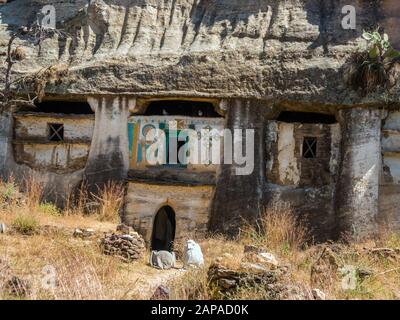 Ethiopian people outside Medhane Alem Adi Kasho rock hewn church , Teka Tesfai, Tigray  Region, Ethiopia. Stock Photo