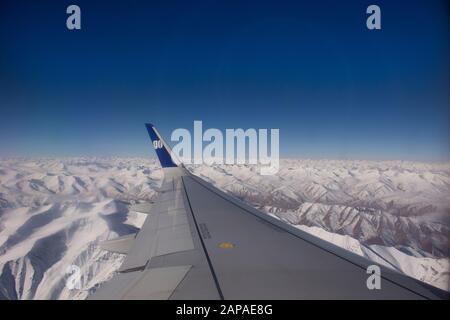 JAMMU KASHMIR, INDIA - MARCH 19 : Aerial view landscape with himalaya range mountains from airbus fly go to Kushok Bakula Rimpochee Airport at Leh Lad Stock Photo