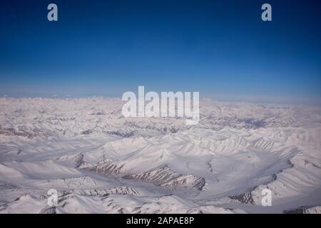 Aerial view landscape with himalaya range mountains from airbus flying from New delhi go to Kushok Bakula Rimpochee Airport at Leh Ladakh village in J Stock Photo