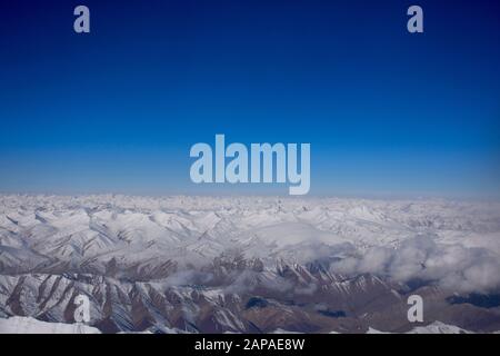 Aerial view landscape with himalaya range mountains from airbus flying from New delhi go to Kushok Bakula Rimpochee Airport at Leh Ladakh village in J Stock Photo