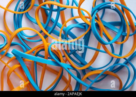 pile of colorful small rubber bands isolated on a white back ground randomly placed Stock Photo