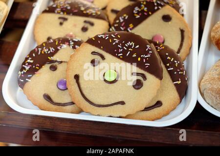 smiley face biscuit display in bakery shop window norfolk