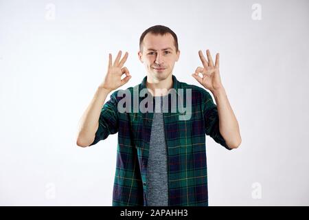 Man is happy, makes gestures with his hands, OK Stock Photo