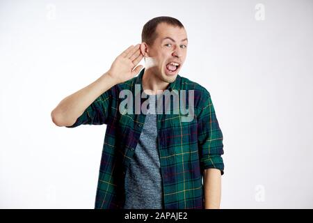 Man does not hear well, makes gestures with his hands Stock Photo