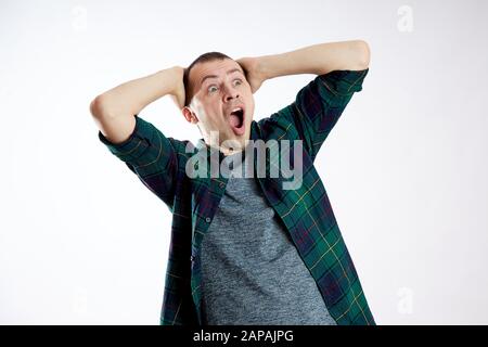 Guy looks surprised, confused. Unexpected emotions, bewilderment and shock man Stock Photo