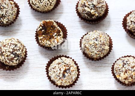 Homemade healthy candy made from dried fruits, honey and nuts. Rustic style. Stock Photo