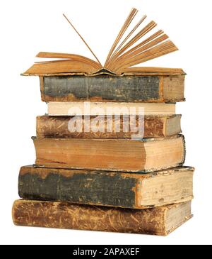 Isolated books. Open book on top of old books stack isolated on white background with clipping path Stock Photo