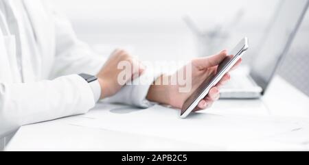 Closeup of girl using smart phone at home Stock Photo