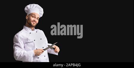 Funny Cook Guy Sharpening Knives Posing In Studio, Panorama, Stock Photo