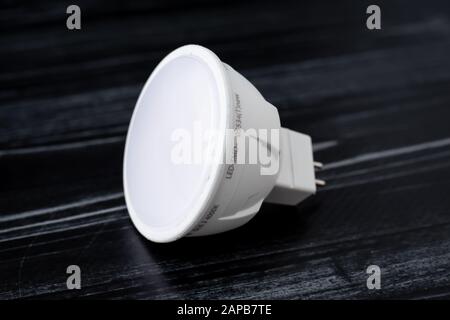 White led lamp on black background. A small diode lamp, gu 5.3 Stock Photo