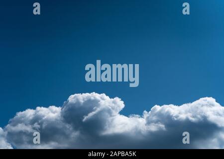 Cumulus Clouds Against a Blue Sky. Summer day Stock Photo