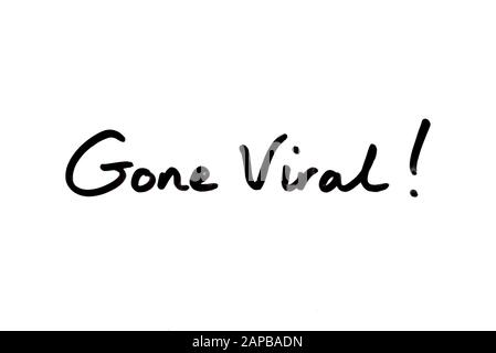 Close-up of the phrase Gone Viral! handwritten on a white background. Stock Photo