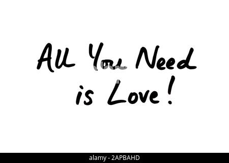 Close-up of the phrase All You Need Is Love! handwritten on a white background. Stock Photo