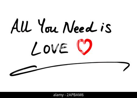 Close-up of the phrase All You Need Is Love handwritten on a white background. Stock Photo