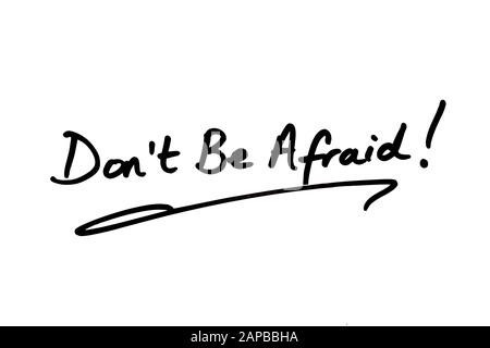 Close-up of a Don’t Be Afraid! message handwritten on a white background. Stock Photo