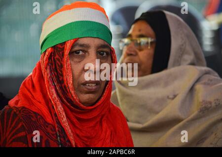 Women Protest against CAA & NRC, Shaheen Bagh, New Delhi, India-January 12, 2020: A woman with tricolor bend protesting against the CAA-NRC. Stock Photo