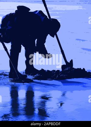 Metal Detecting on a Somerset beach in UK Stock Photo