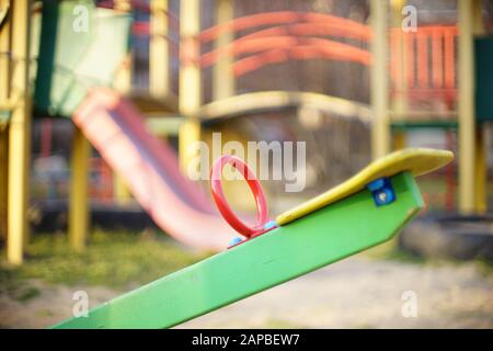 Playground with a new swing teeterboard close up. Stock Photo