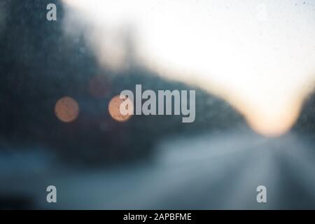 defocused lights of a car coming in front Stock Photo
