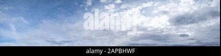 Fluffy clouds in the overcast sky view. Climate, environment and weather concept sky background. Stock Photo