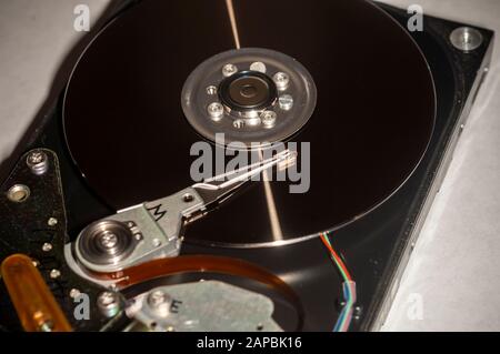 Platter and read/write mechanism from a circa 1992 hard drive seen on Thursday, January 9, 2020. (© Richard B. Levine) Stock Photo
