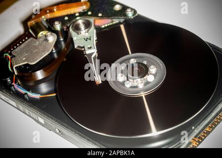 Platter and read/write mechanism from a circa 1992 hard drive seen on Thursday, January 9, 2020. (© Richard B. Levine) Stock Photo