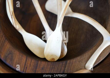 Wooden spoons made from local wood look good and are easy to use in the kitchen Stock Photo