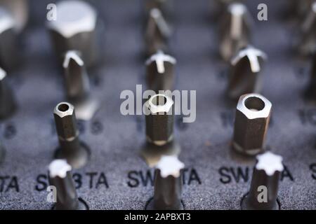 Makro close up of tool box with set of different types screw drive heads bits (Focus on hex socket head) Stock Photo