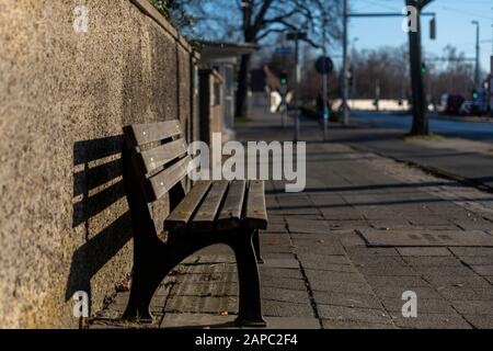 Bench inviting tired pedestrians in Braunschweig winter sunshine Stock Photo