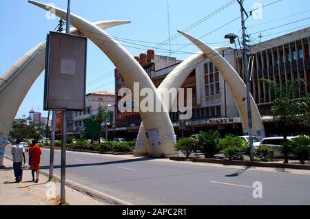 Mombasa, Kenya - February 4th 2011: Giant Ivory tusks - the town's landmark in the main street Ivory-Avenue in Mombasa, Africa Stock Photo