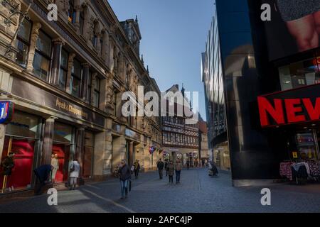 Brunschwick, Germany - jan 21th 2020: People browsing through Braunschweig old town shops for discount shopping during seasonal sales. Stock Photo