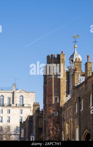 Main gate of St. James' Palace where the Accession Council meets after the death of a monarch, with Tudor era towers and brickwork, London, UK Stock Photo