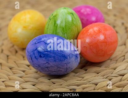 Colorful easter eggs in basket Stock Photo