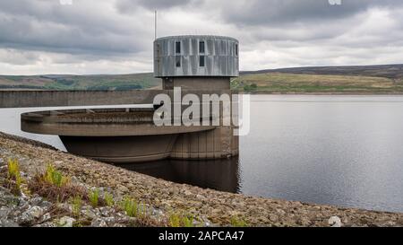 The outlet tower and spillway of the Grimwith Reservoir near Howgill, North Yorkshire, England, UK Stock Photo