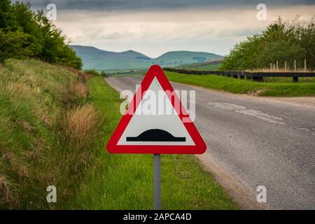 Street sign - uneven road, on the way to Grimwith Reservoir, North Yorkshire, England, UK Stock Photo