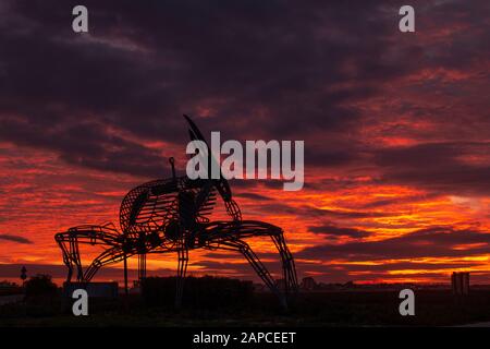 FARO, PORTUGAL: 8th DECEMBER 2019 - Crab statue in the natural marshlands at sunset located in Ria Formosa, Algarve, Portugal. Stock Photo