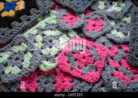 pile of different granny squares , in different colours . Stock Photo