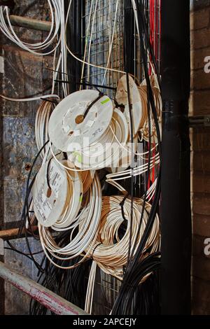 Cabling in a service shaft, in process of installation Stock Photo