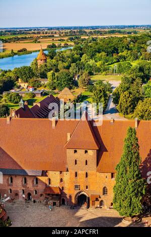Malbork, Pomerania / Poland - 2019/08/24: Aerial panoramic view of the inner courtyard of the Middle Castle part of the medieval Teutonic Order castle Stock Photo