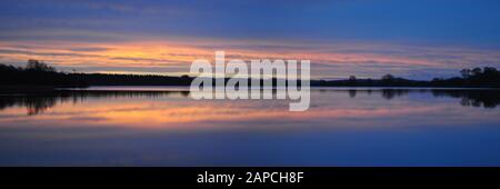 Sunrise over Castle Loch, Lochmaben, Dumfries and Galloway, Scotland Stock Photo